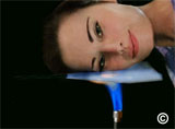 Thermablok's amazing heat resistance demonstrated by placing a face right on the material with a hot flame below